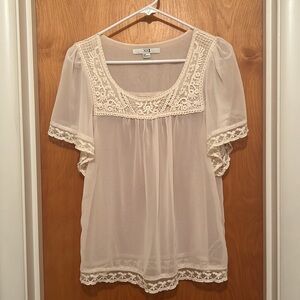 Sheer Ivory colored blouse with lace detail. Size s
